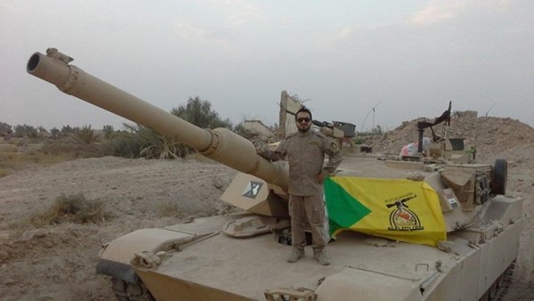 M1A1-Abrams-tank-draped-in-Hezbollah-flag-e1420750328467